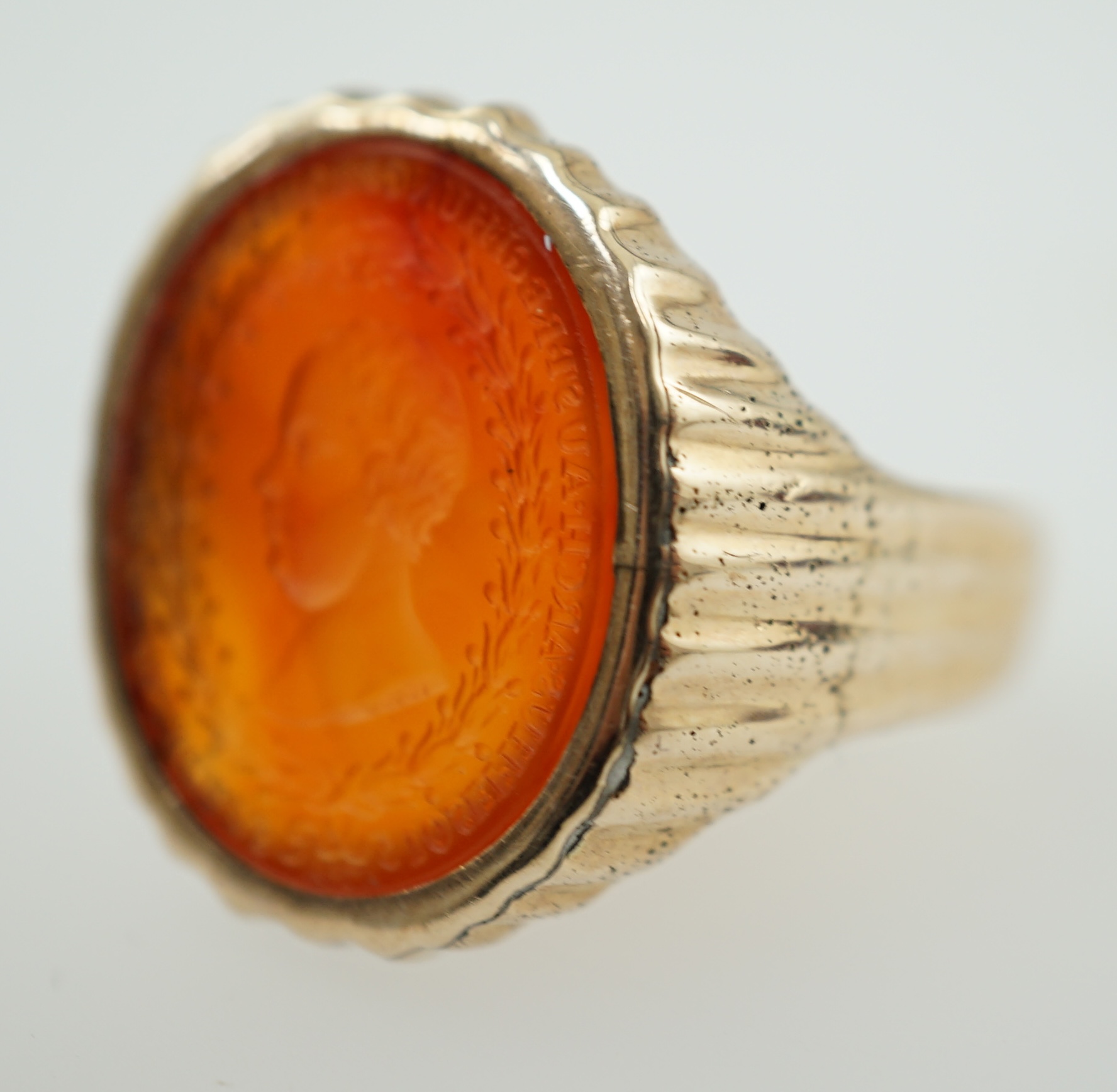 An antique Austro Hungarian gold and carnelian intaglio set oval ring, carved with the bust to dexter of Arch Duke Joseph